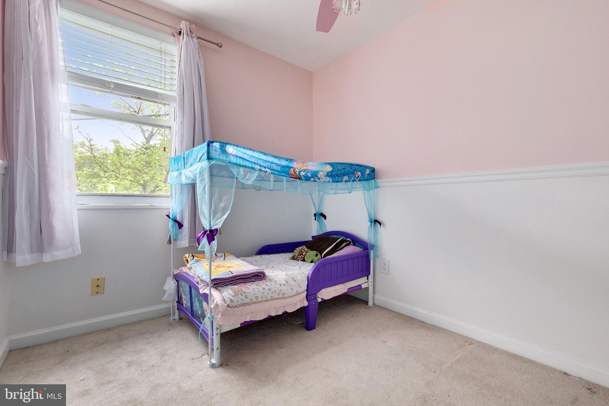 12114 Dalewood Drive Silver Spring, MD 20902 - Photo 15 of 24 a room with a bed and a window