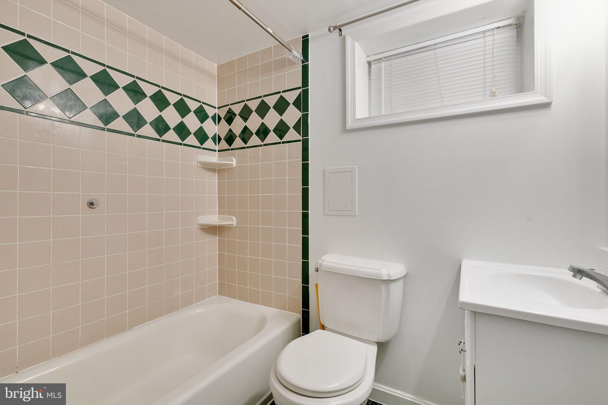 12114 Dalewood Drive Silver Spring, MD 20902 - Photo 19 of 24 a bathroom with a toilet and a shower