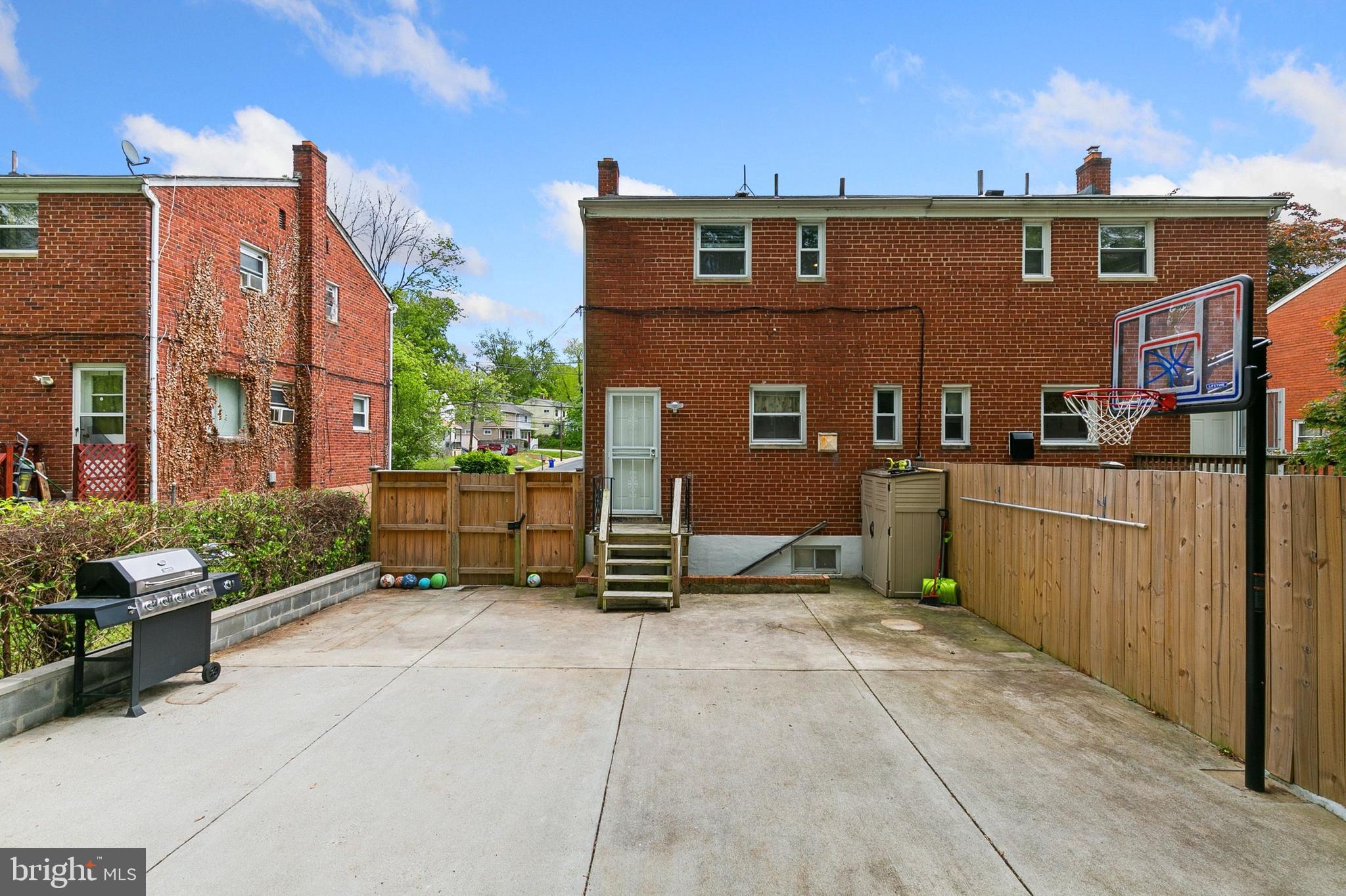 12114 Dalewood Drive Silver Spring, MD 20902 - Photo 22 of 24 a view of a brick building with many windows