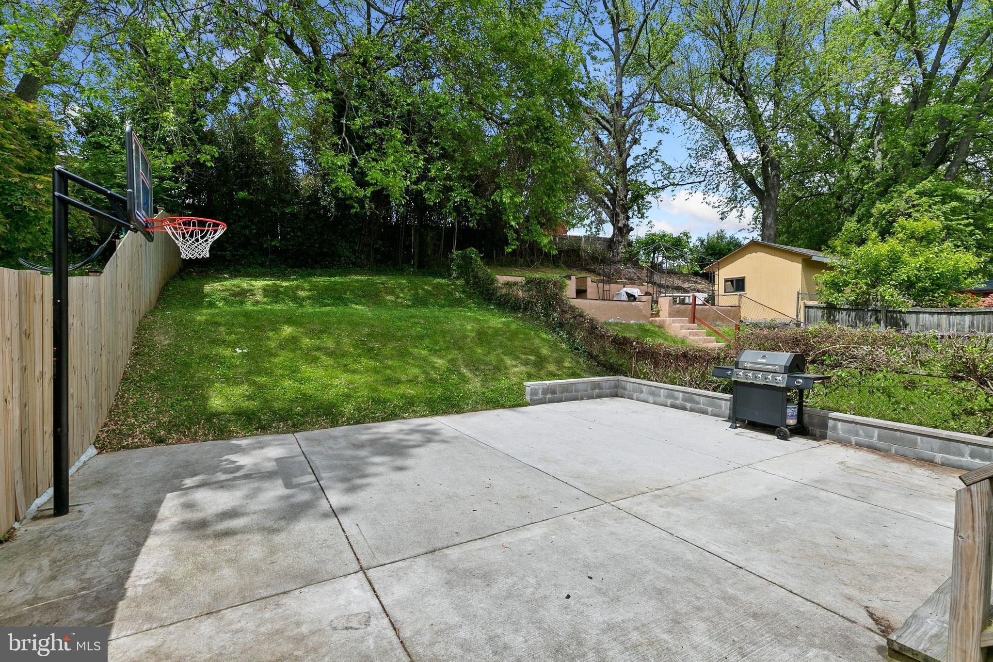 12114 Dalewood Drive Silver Spring, MD 20902 - Photo 24 of 24 a backyard of a house with lots of green space