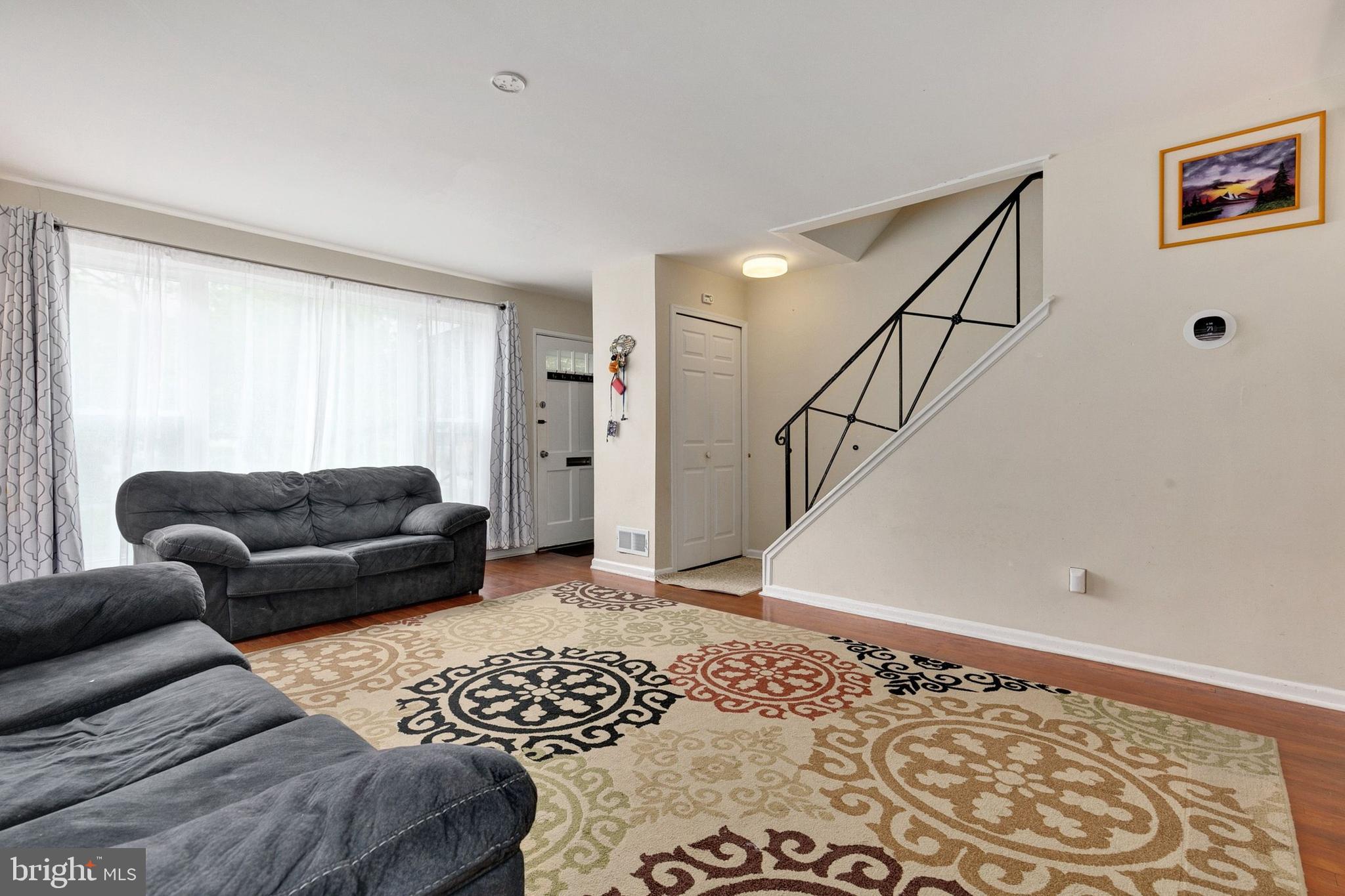 12114 Dalewood Drive Silver Spring, MD 20902 - Photo 4 of 24 a living room with furniture and a rug
