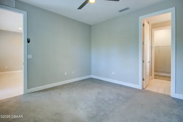 an empty room with a empty space and a window