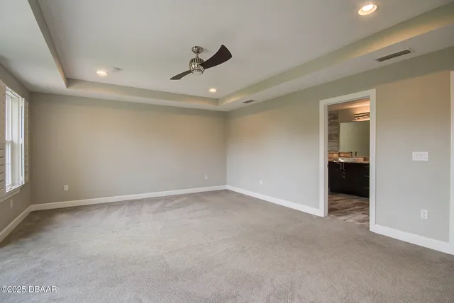 an empty room with a empty space and windows