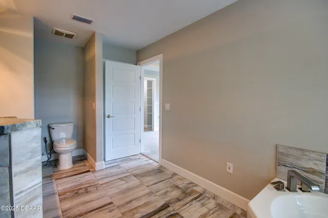 a bathroom with a sink and a toilet