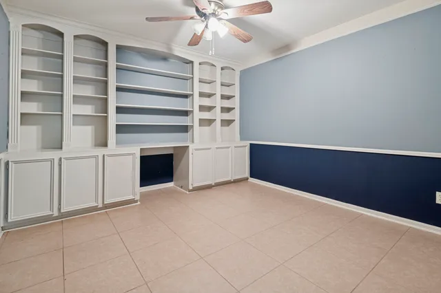 a view of an empty room with a fireplace