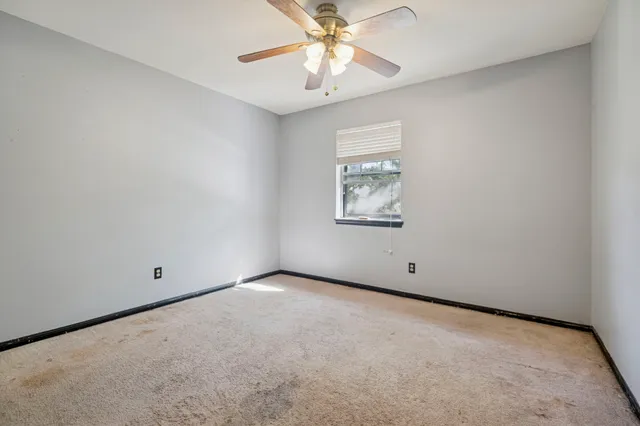 a view of a livingroom with a kitchen