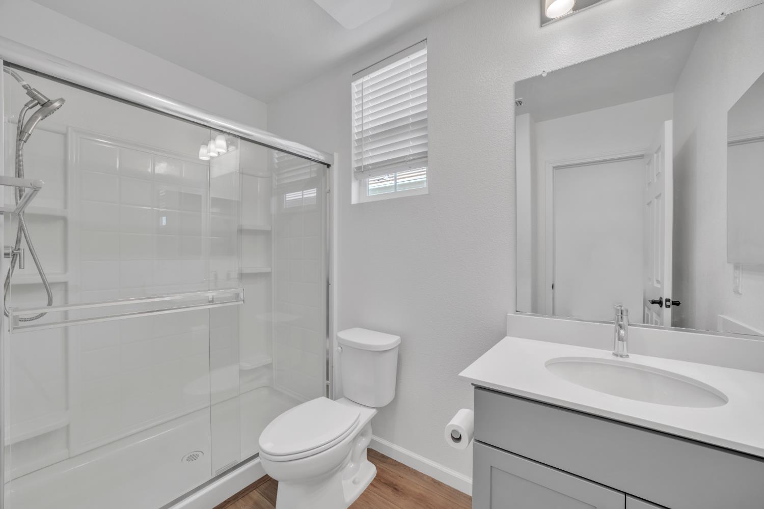 4562 Butterfly Ridge Drive Folsom, CA 95630 - Photo 17 of 44 a bathroom with a sink toilet vanity and shower