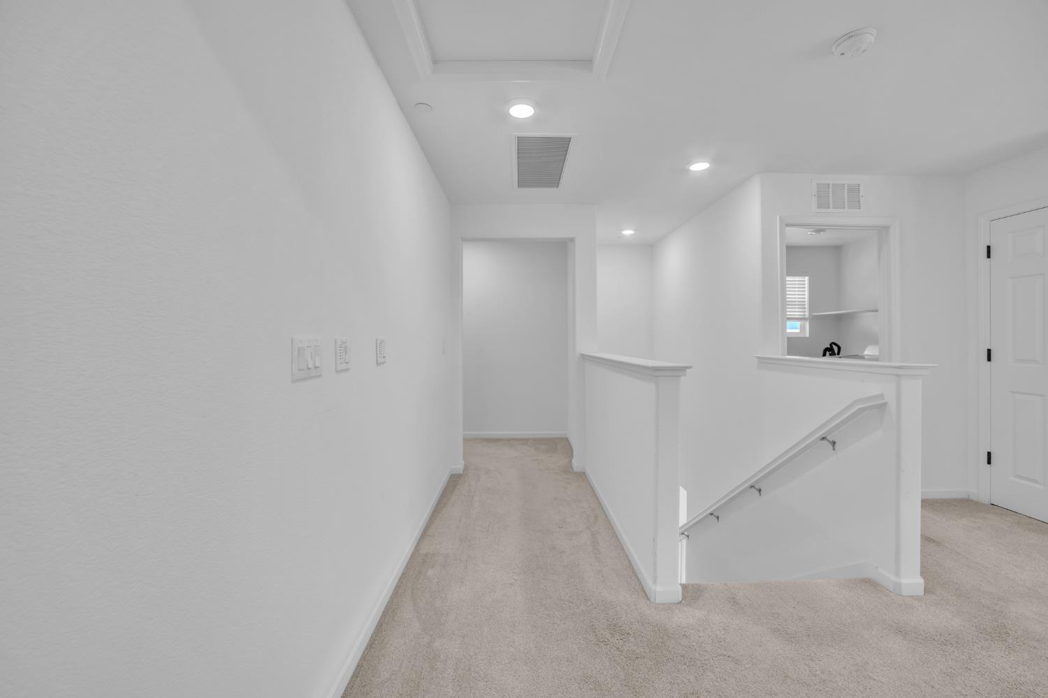 4562 Butterfly Ridge Drive Folsom, CA 95630 - Photo 28 of 44 wooden floor in an empty room with a kitchen