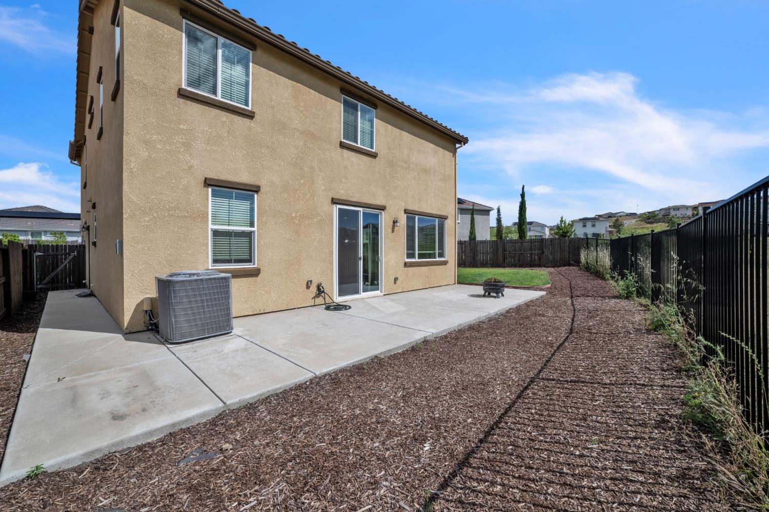 4562 Butterfly Ridge Drive Folsom, CA 95630 - Photo 36 of 44 a view of a patio with a table and chairs