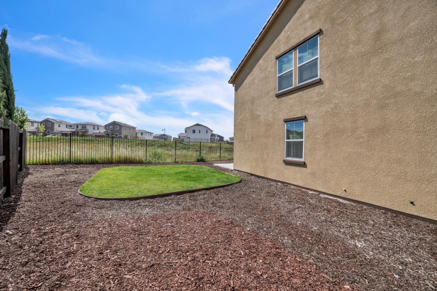 4562 Butterfly Ridge Drive Folsom, CA 95630 - Photo 39 of 44 a view of a big house with a backyard