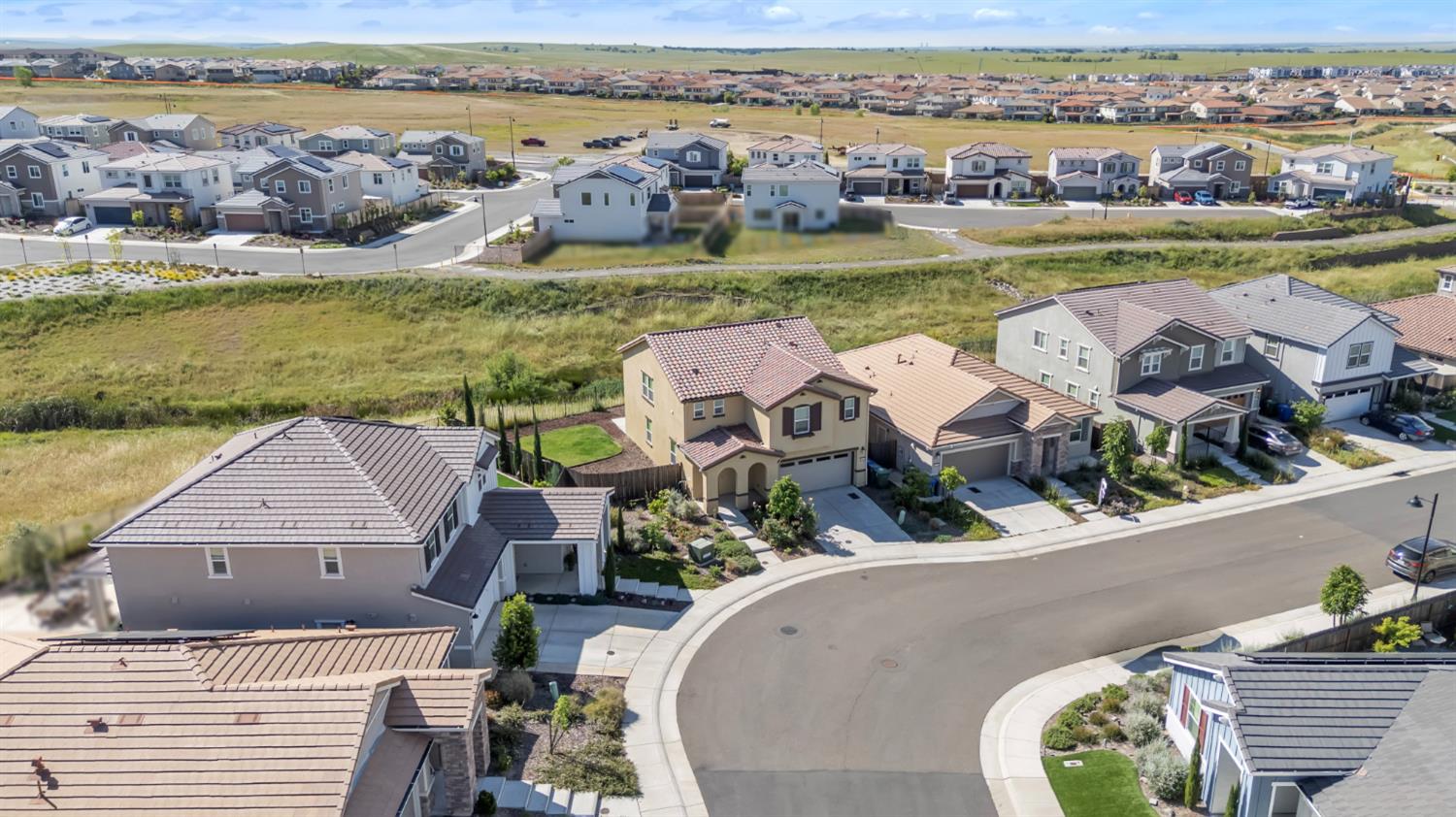 4562 Butterfly Ridge Drive Folsom, CA 95630 - Photo 41 of 44 an aerial view of a house with outdoor space and ocean view