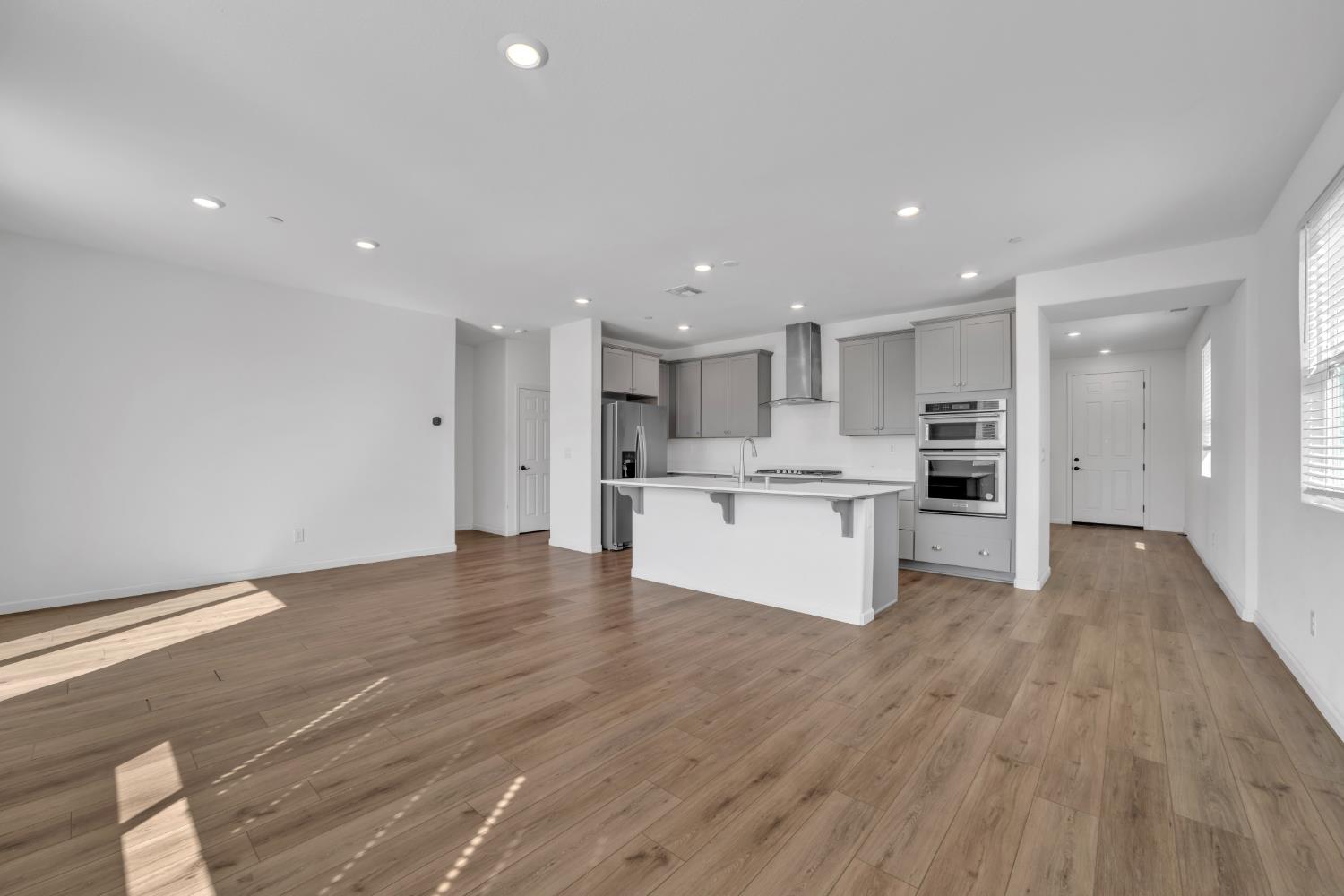 4562 Butterfly Ridge Drive Folsom, CA 95630 - Photo 7 of 44 a view of kitchen with wooden floor