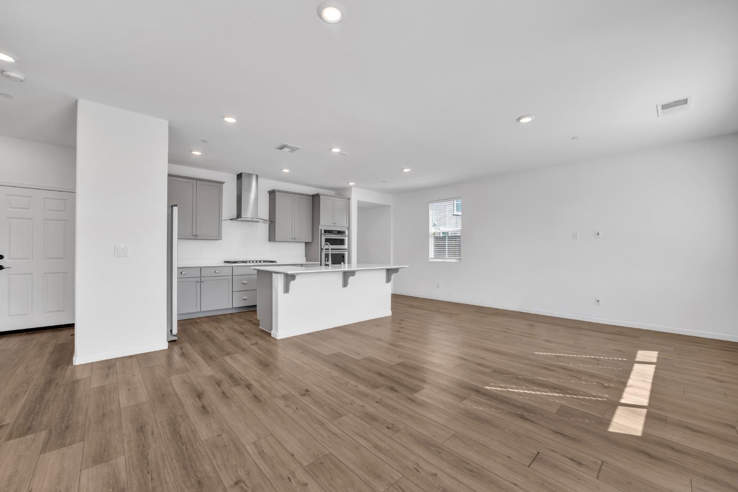 4562 Butterfly Ridge Drive Folsom, CA 95630 - Photo 8 of 44 a view of kitchen with wooden floor and windows