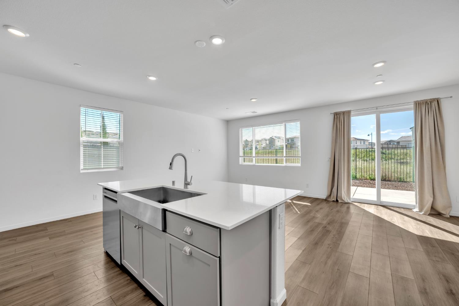 4562 Butterfly Ridge Drive Folsom, CA 95630 - Photo 10 of 44 a view of center island wooden floor and windows