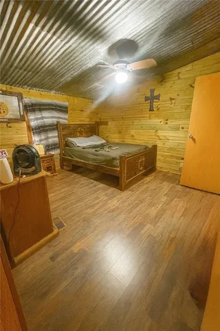a view of a room with wooden walls