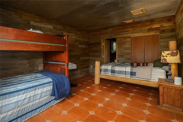 a bedroom with double bed and a walk in closet