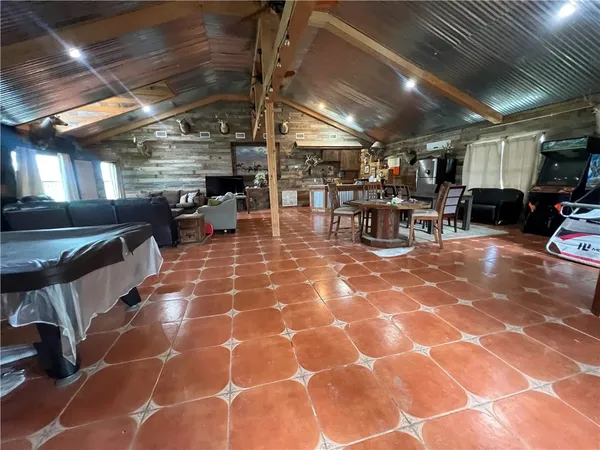 a view of a studio with wooden floor