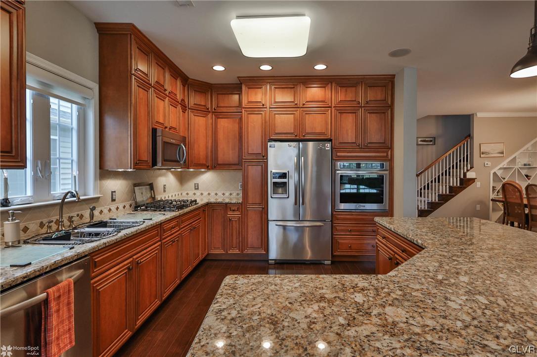 1035 Declaration Drive Bethlehem, PA 18017 - Photo 13 of 38 a kitchen with refrigerator and cabinets