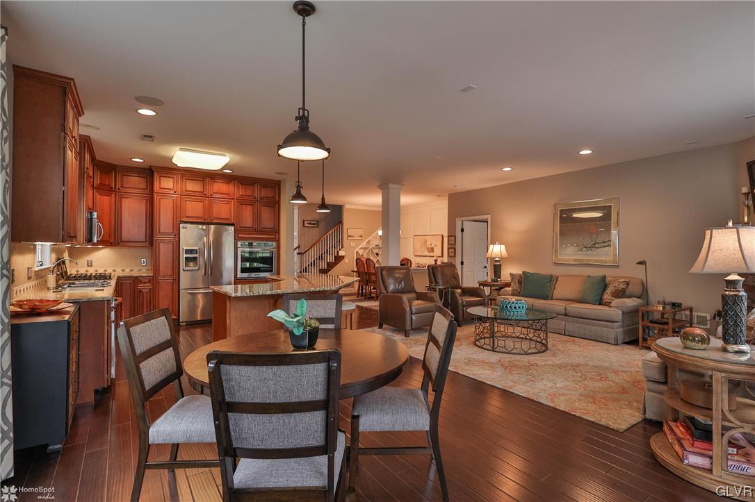 1035 Declaration Drive Bethlehem, PA 18017 - Photo 17 of 38 a living room with lots of furniture and a chandelier