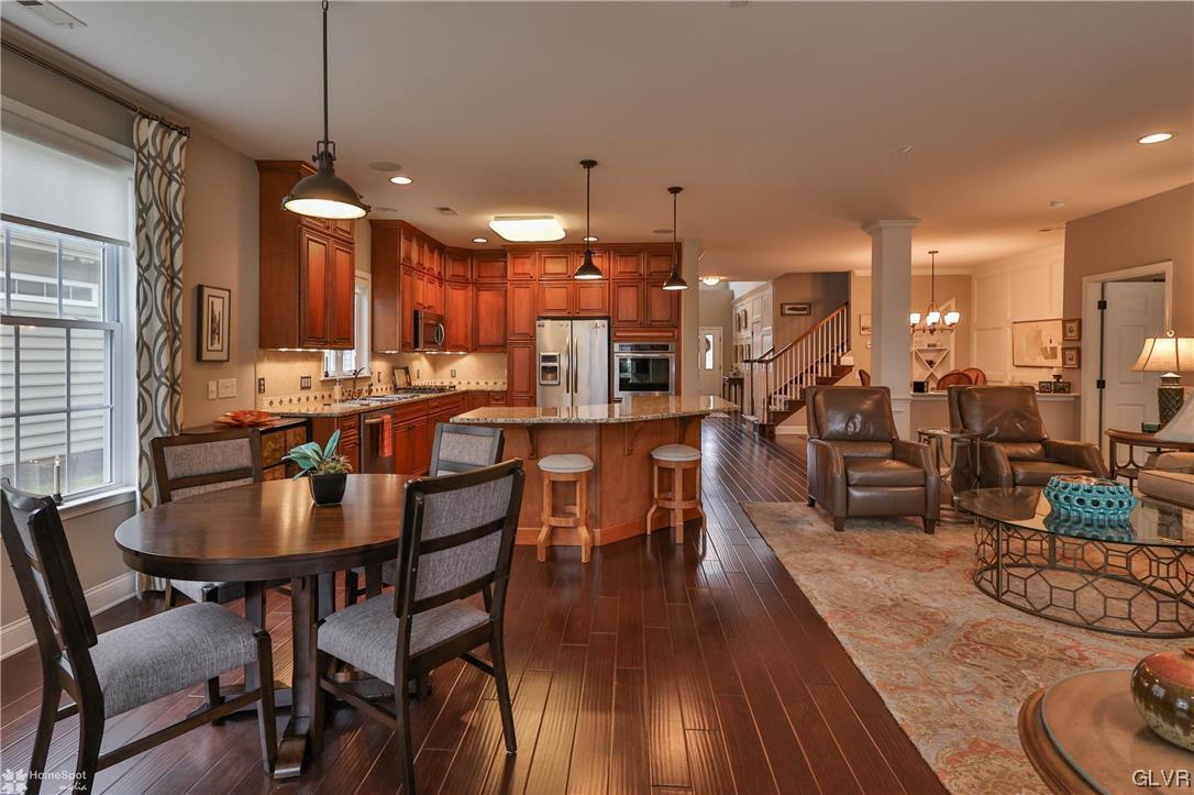 1035 Declaration Drive Bethlehem, PA 18017 - Photo 19 of 38 a dining hall with stainless steel appliances kitchen island a table and chairs