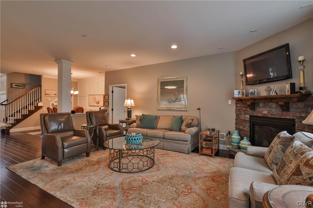 1035 Declaration Drive Bethlehem, PA 18017 - Photo 21 of 38 a living room with furniture flat screen tv and a fireplace