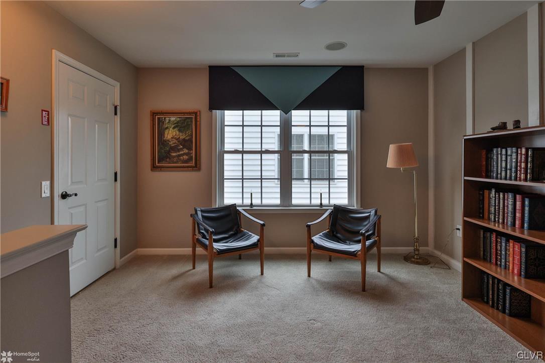 1035 Declaration Drive Bethlehem, PA 18017 - Photo 28 of 38 a living room with furniture and a book shelf