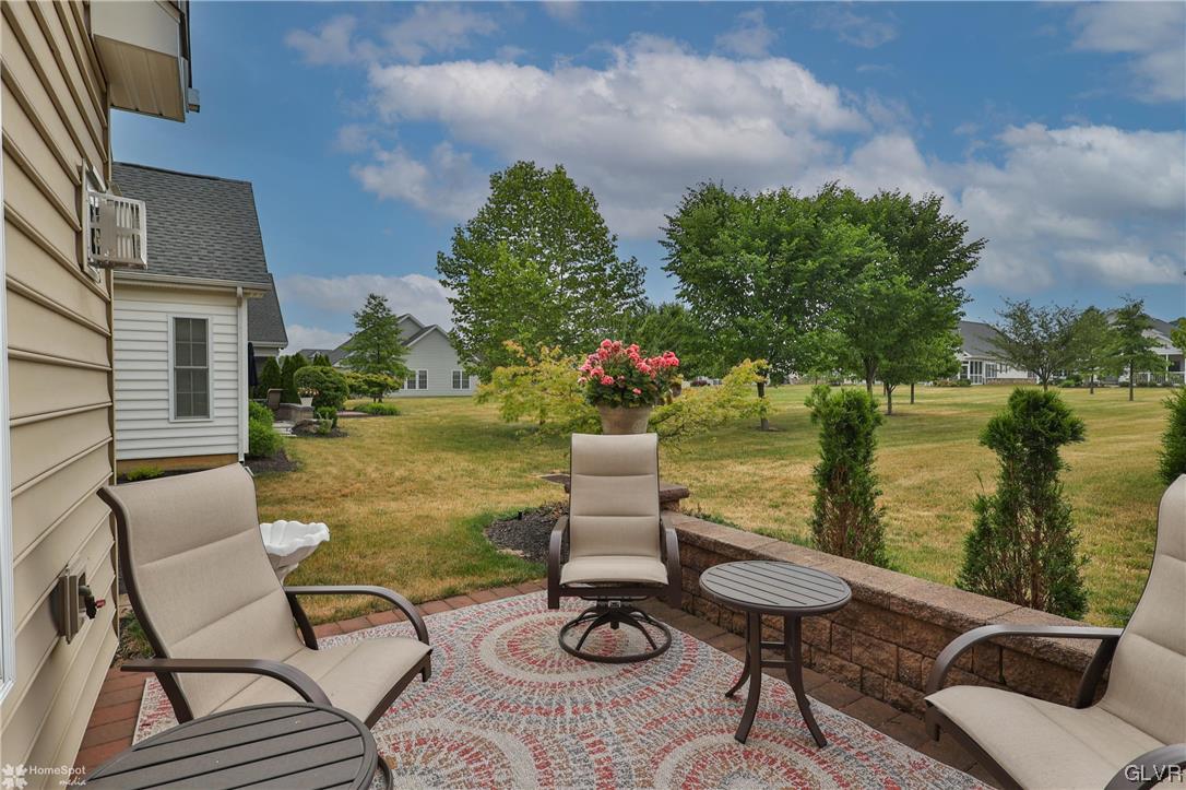 1035 Declaration Drive Bethlehem, PA 18017 - Photo 31 of 38 a view of a lake with couches chairs and a table