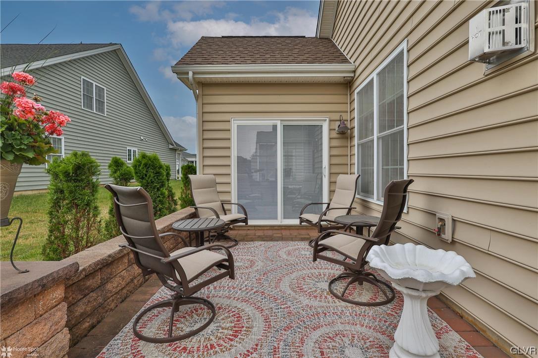 1035 Declaration Drive Bethlehem, PA 18017 - Photo 32 of 38 a view of a chairs and table in patio with wooden fence