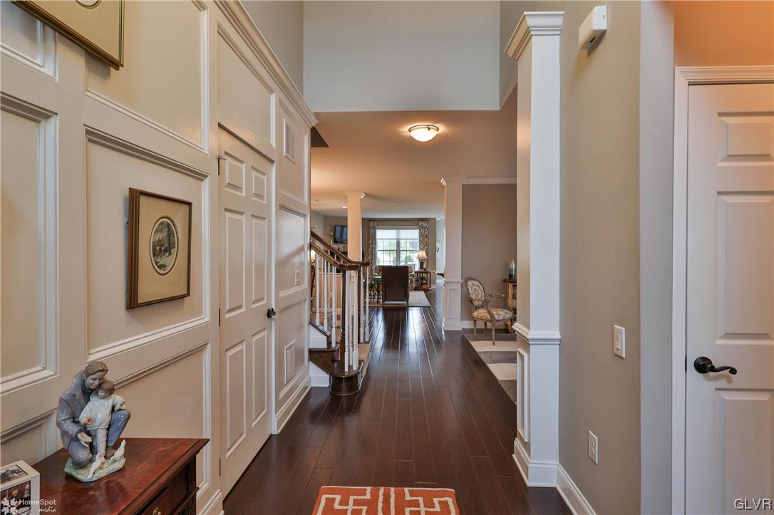 1035 Declaration Drive Bethlehem, PA 18017 - Photo 5 of 38 a hallway with a dining table wooden floor and a dining table
