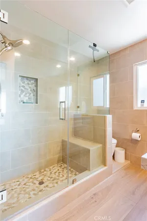 a bathroom with a shower and toilet