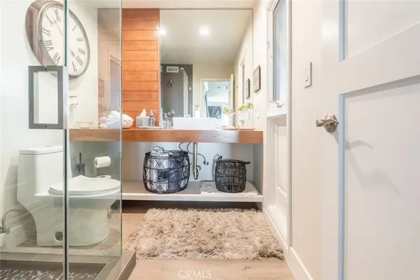 a living room with patio furniture and a floor to ceiling window