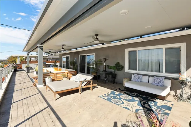 a balcony with table and chairs