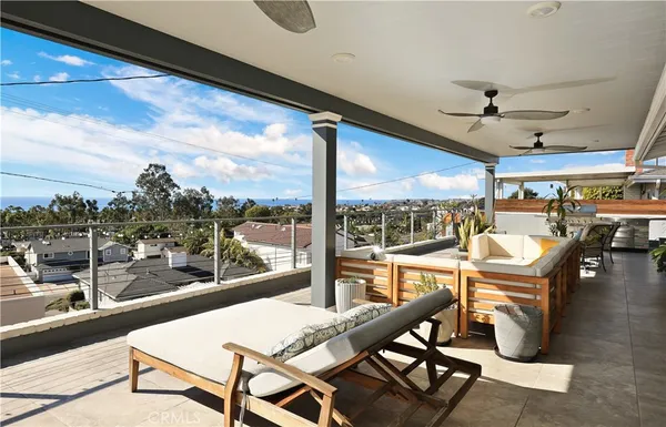 a living room with couches and a flat screen tv