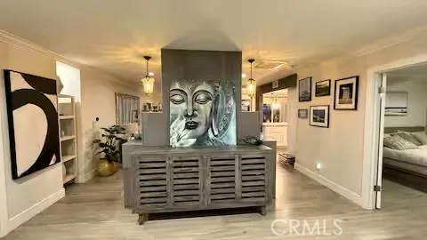 a view of a hallway with closet and mirror