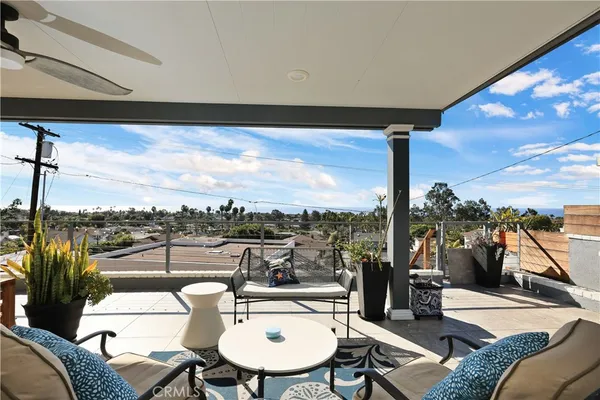a view of a balcony with furniture