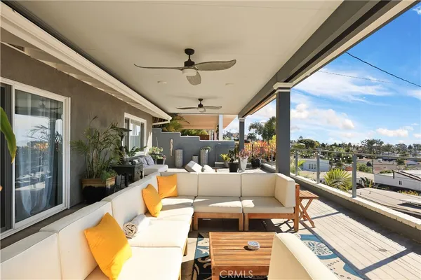 a view of a chairs and table in patio