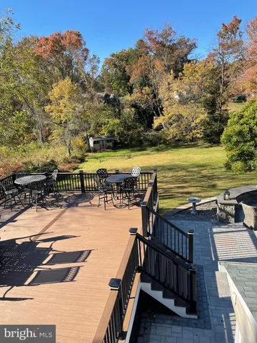 a view of balcony with wooden floor and seating space