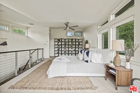 a view of a livingroom with furniture window and wooden floor