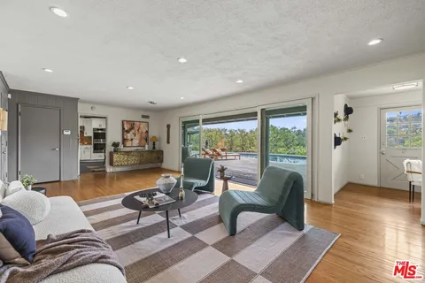 a living room with furniture and a table