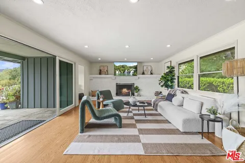 a living room with furniture and a rug