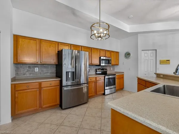 $575,000 | 24360 Sandpiper Isle Way, Unit 205, Bonita Springs, FL 34134