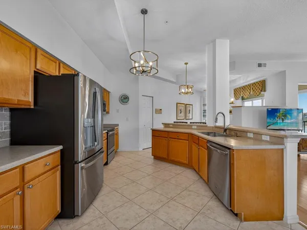 $575,000 | 24360 Sandpiper Isle Way, Unit 205, Bonita Springs, FL 34134
