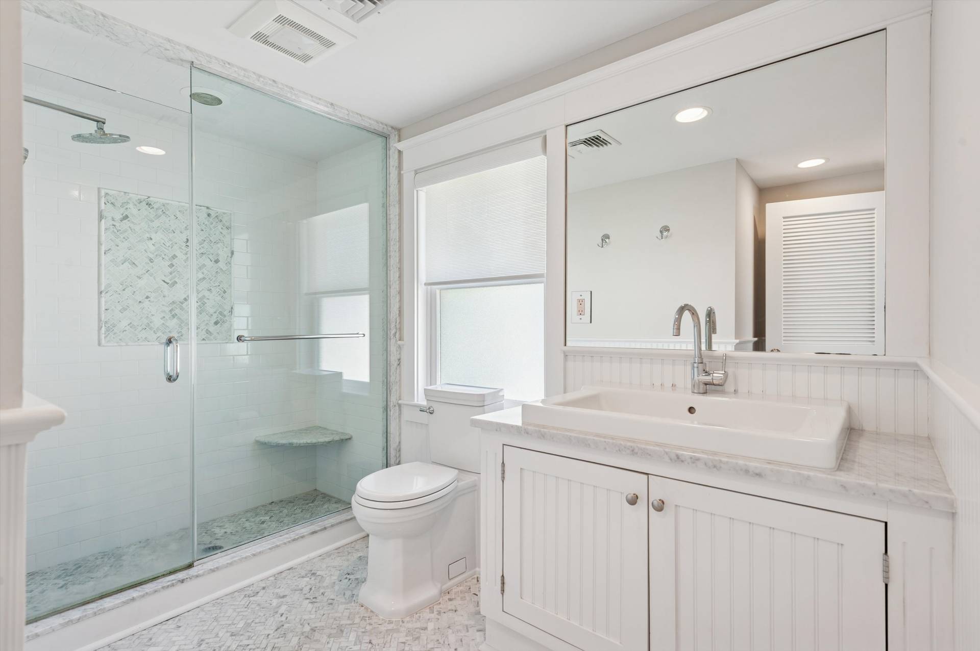 135 Little Neck Road Southampton, NY 11968 - Photo 14 of 20 a bathroom with a sink a toilet and shower