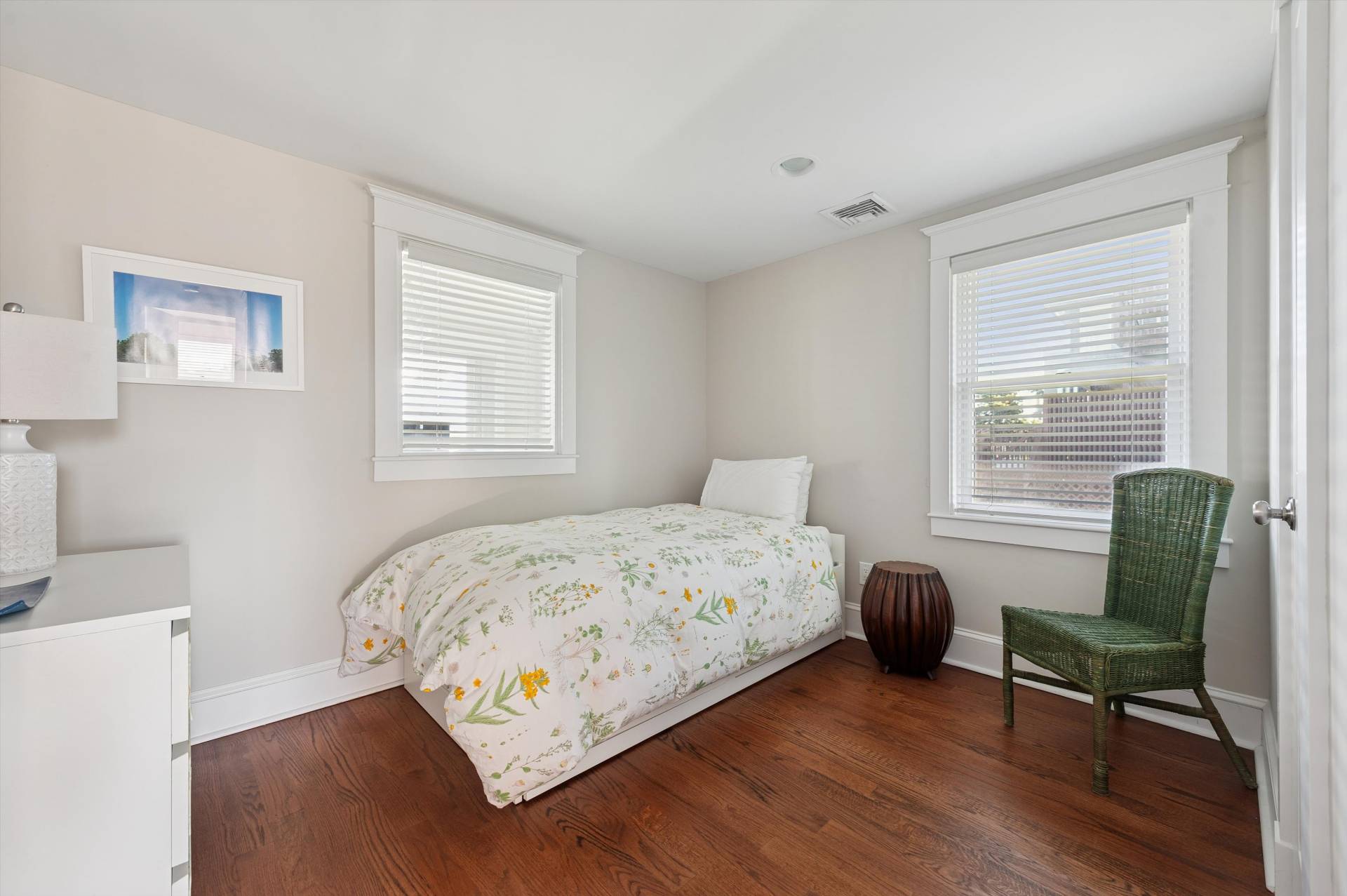 135 Little Neck Road Southampton, NY 11968 - Photo 17 of 20 a bedroom with a bed and a chair