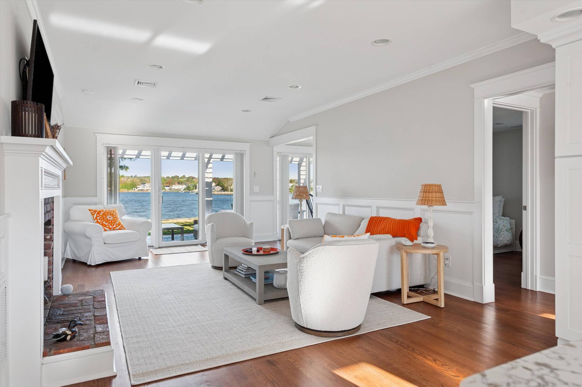 135 Little Neck Road Southampton, NY 11968 - Photo 9 of 20 a living room with furniture and a flat screen tv
