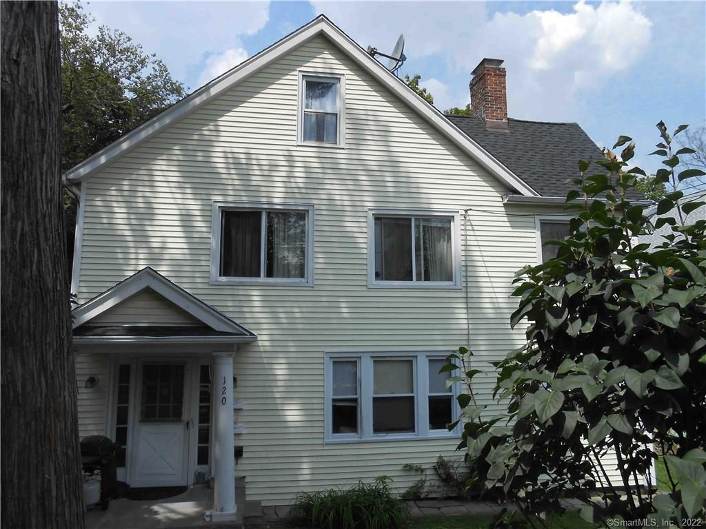 120 Rock Spring Road Stamford, CT 06906 - Photo 1 of 1 a front view of a house with a garden