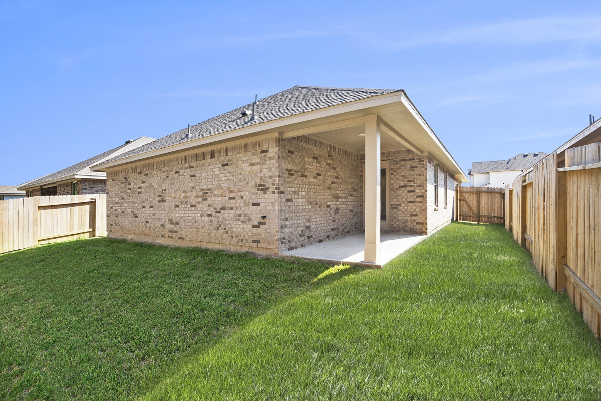 412 Bryan Way Angleton, TX 77515 - Photo 15 of 15 a view of a back yard with a wooden fence