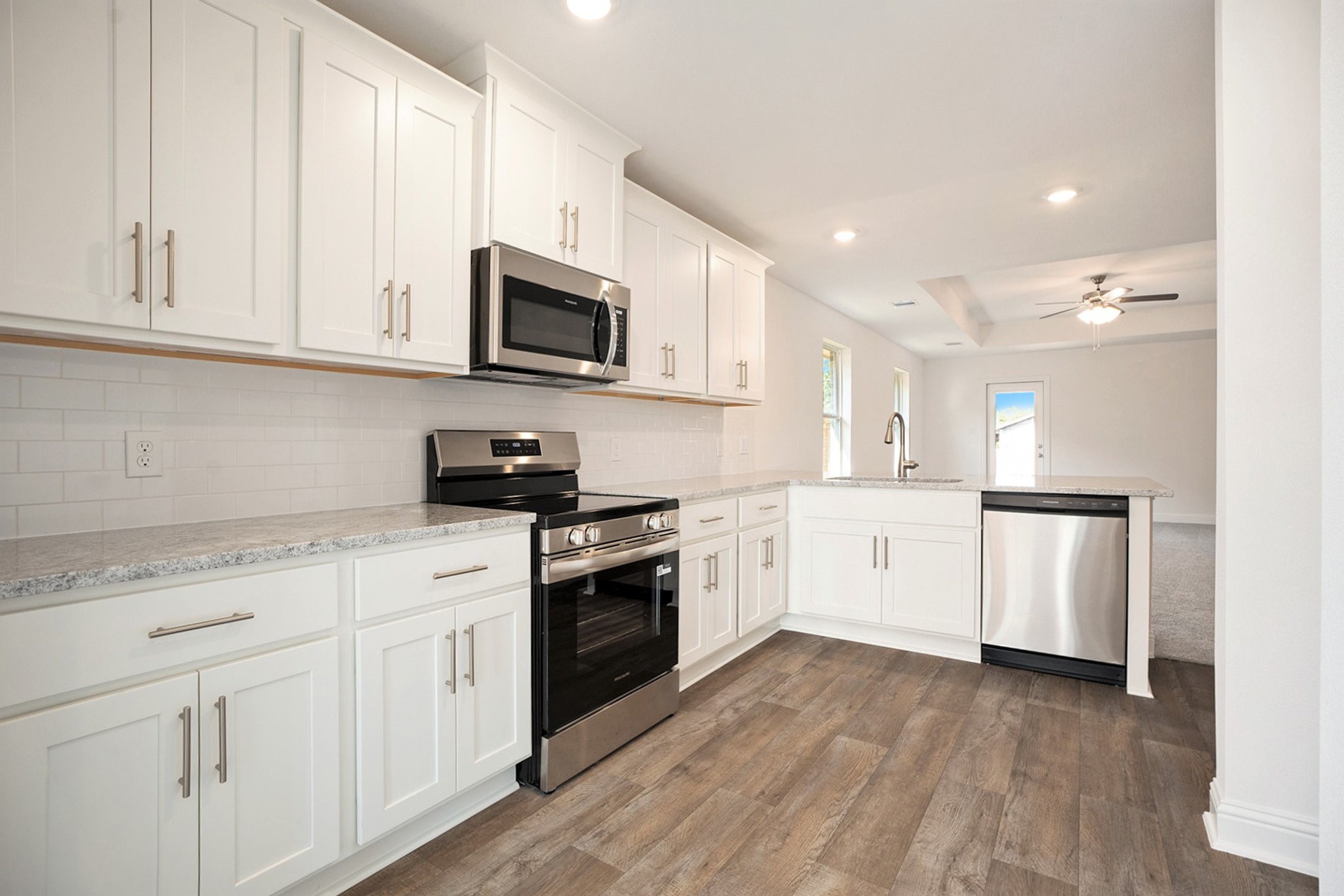 412 Bryan Way Angleton, TX 77515 - Photo 2 of 15 a kitchen with white cabinets stainless steel appliances and sink