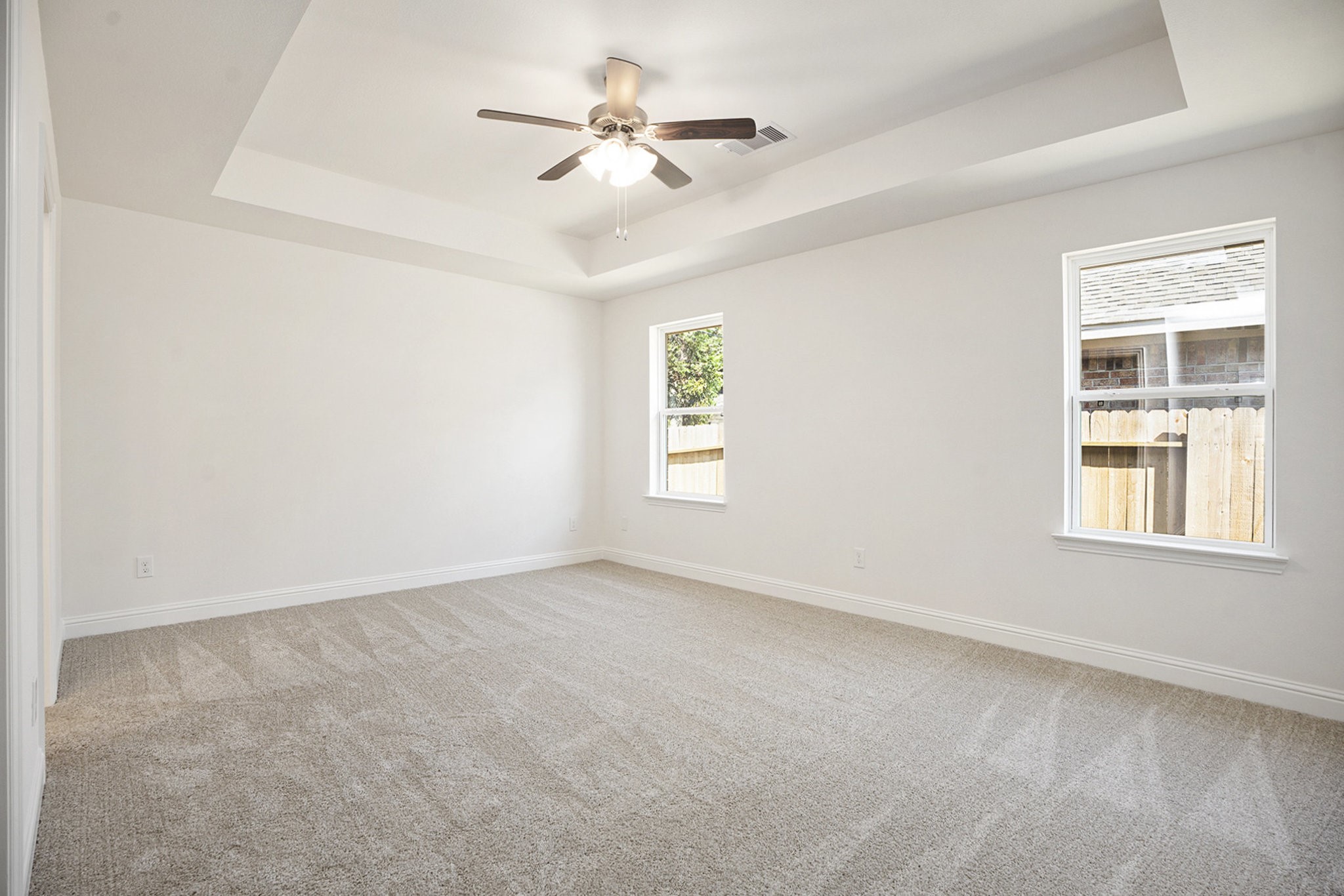 412 Bryan Way Angleton, TX 77515 - Photo 7 of 15 an empty room with a window and a ceiling fan