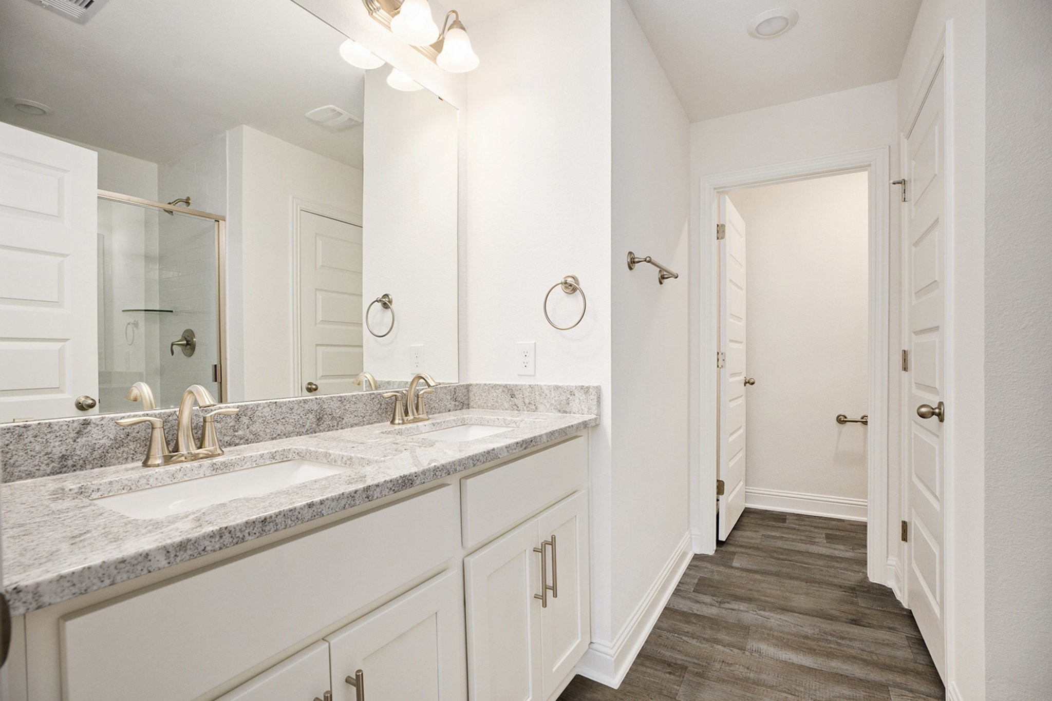 412 Bryan Way Angleton, TX 77515 - Photo 9 of 15 a bathroom with a granite countertop sink mirror and a shower